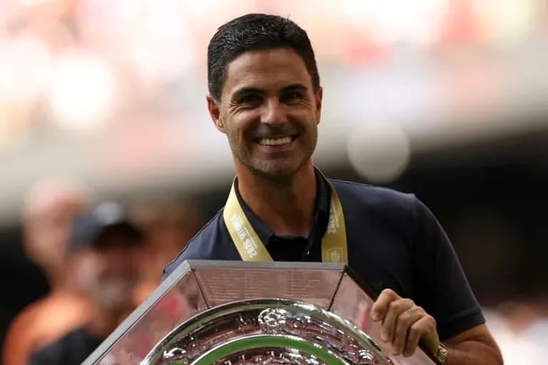 Coach holding trophy during celebratory event Coach holding trophy during celebratory event