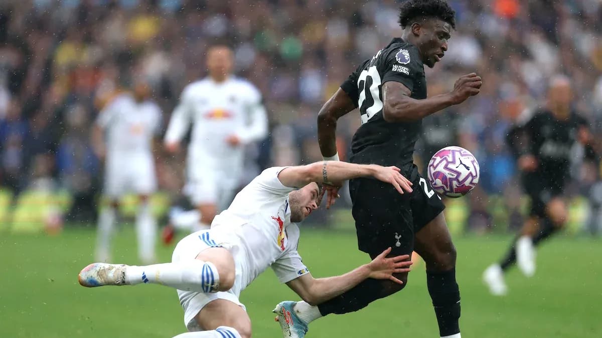 Player tackling opponent during intense football match Player tackling opponent during intense football match