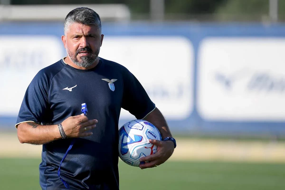 Coach holding a ball during training session Coach holding a ball during training session