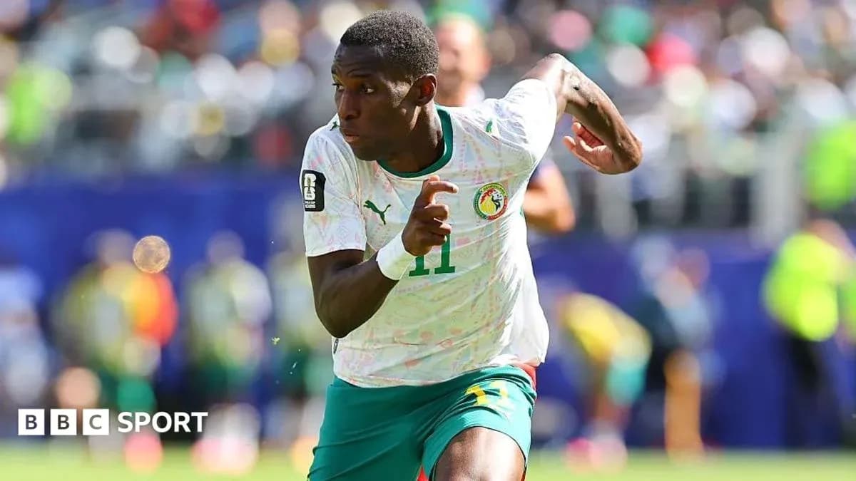 Player sprinting during an African Cup of Nations match Player sprinting during an African Cup of Nations match