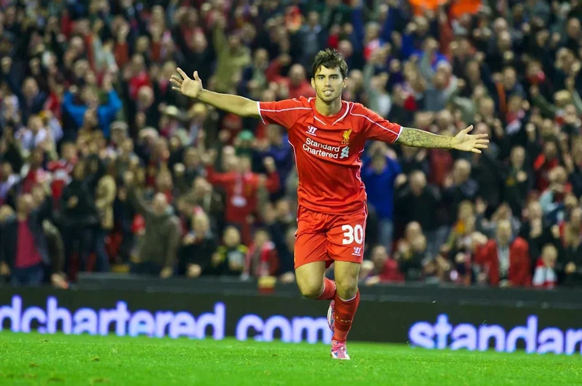 Player celebrating goal in Liverpool jersey at stadium Player celebrating goal in Liverpool jersey at stadium