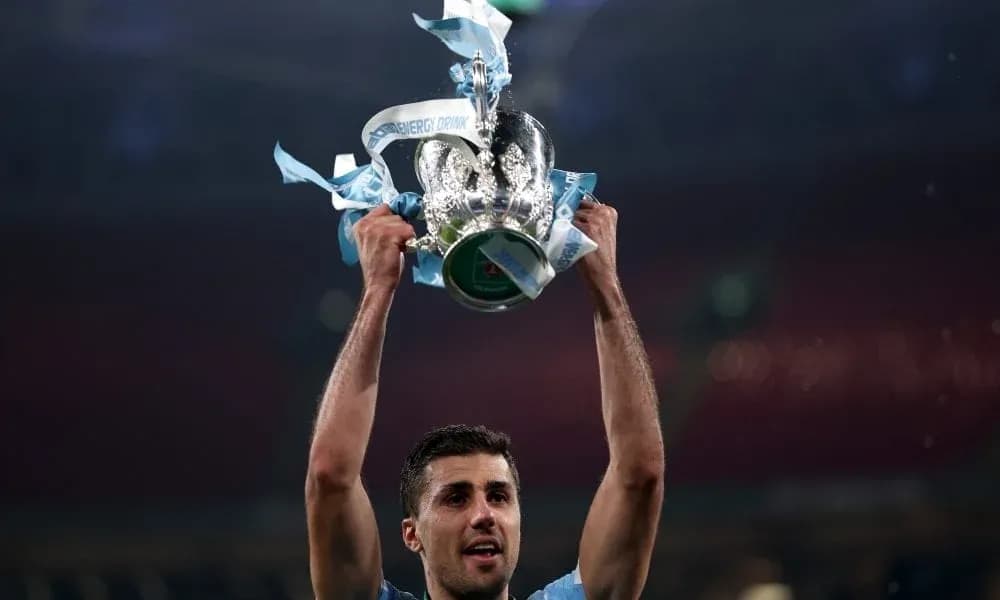 Player holding trophy aloft in celebration Player holding trophy aloft in celebration