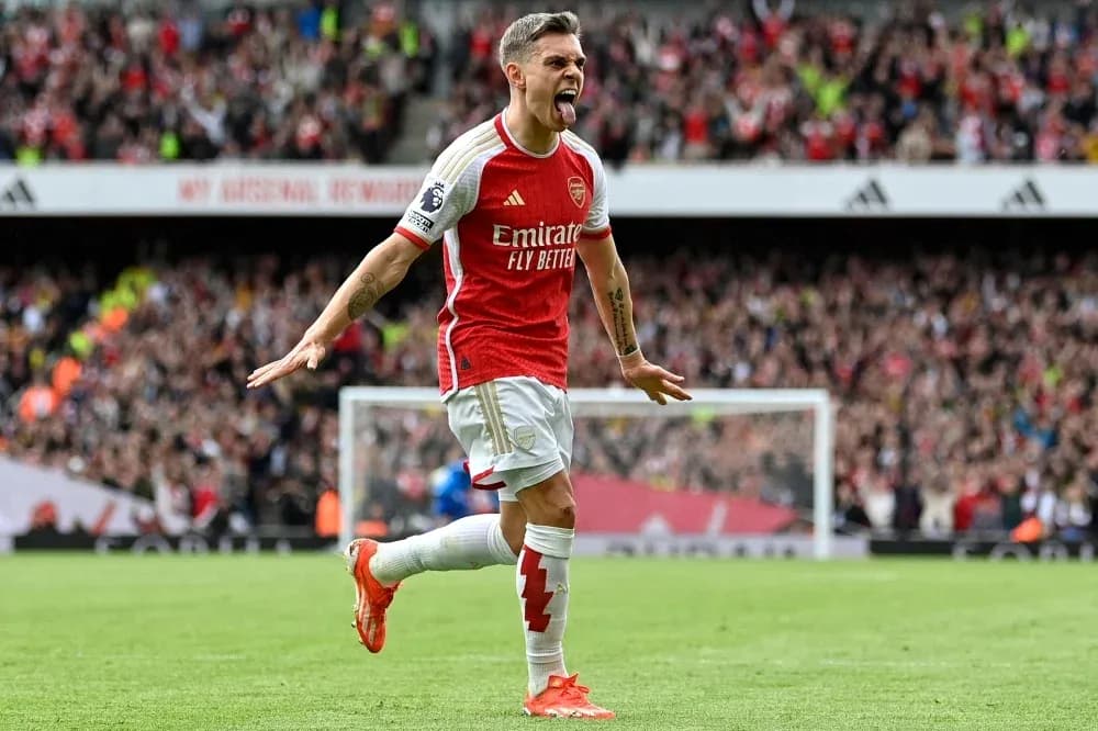 Arsenal player celebrating a goal in stadium Arsenal player celebrating a goal in stadium