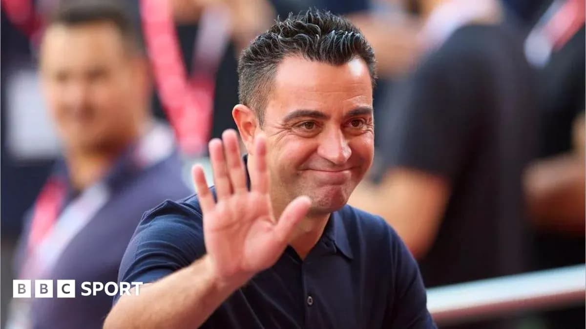 Coach waving and smiling during event Coach waving and smiling during event