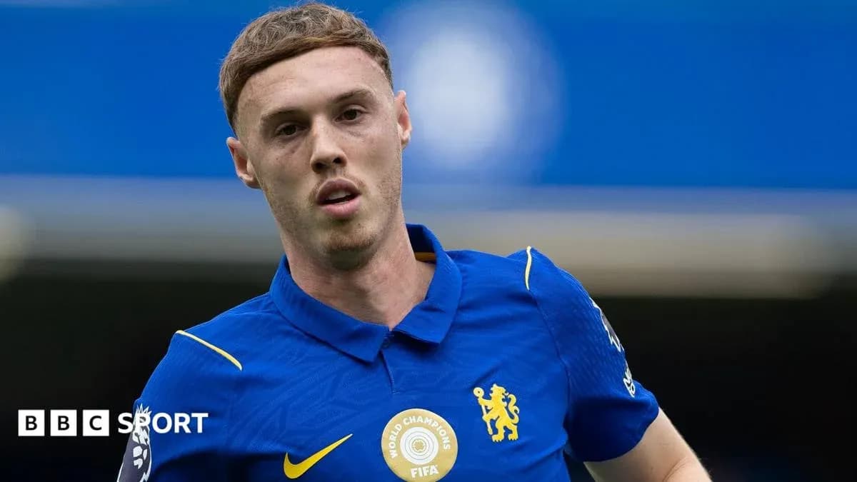 Player wearing blue Chelsea jersey on the field Player wearing blue Chelsea jersey on the field