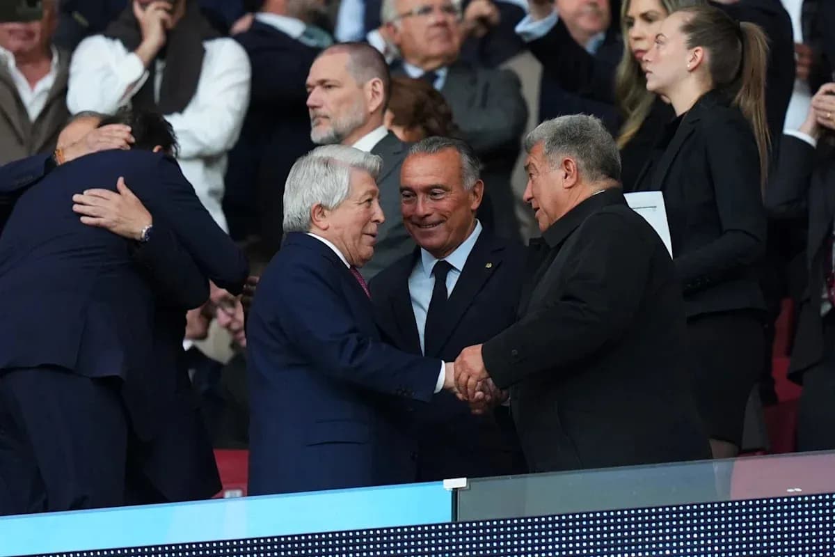 Three men shaking hands in stadium stands Three men shaking hands in stadium stands