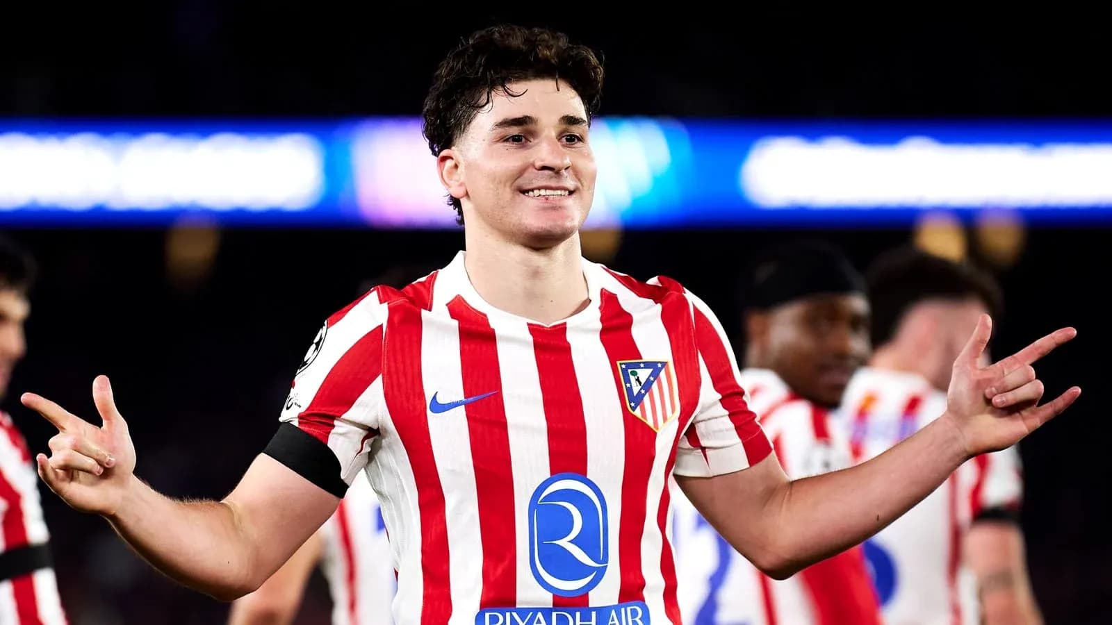 Atletico Madrid player celebrating on the pitch Atletico Madrid player celebrating on the pitch