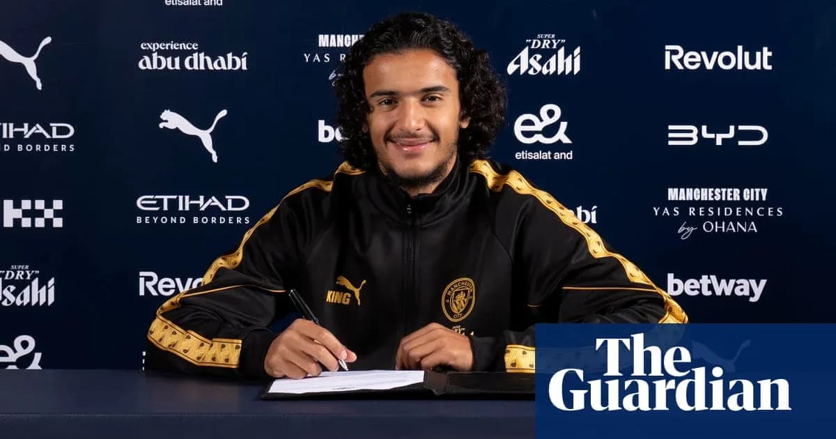 Player signing contract at Manchester City press conference Player signing contract at Manchester City press conference