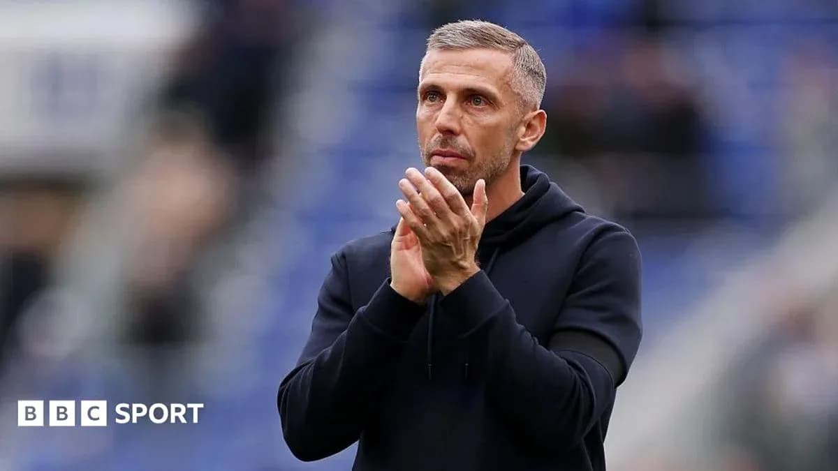 Manager applauding fans during match at stadium Manager applauding fans during match at stadium