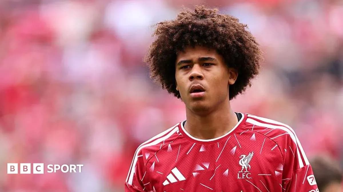 Young player in Liverpool jersey on field Young player in Liverpool jersey on field