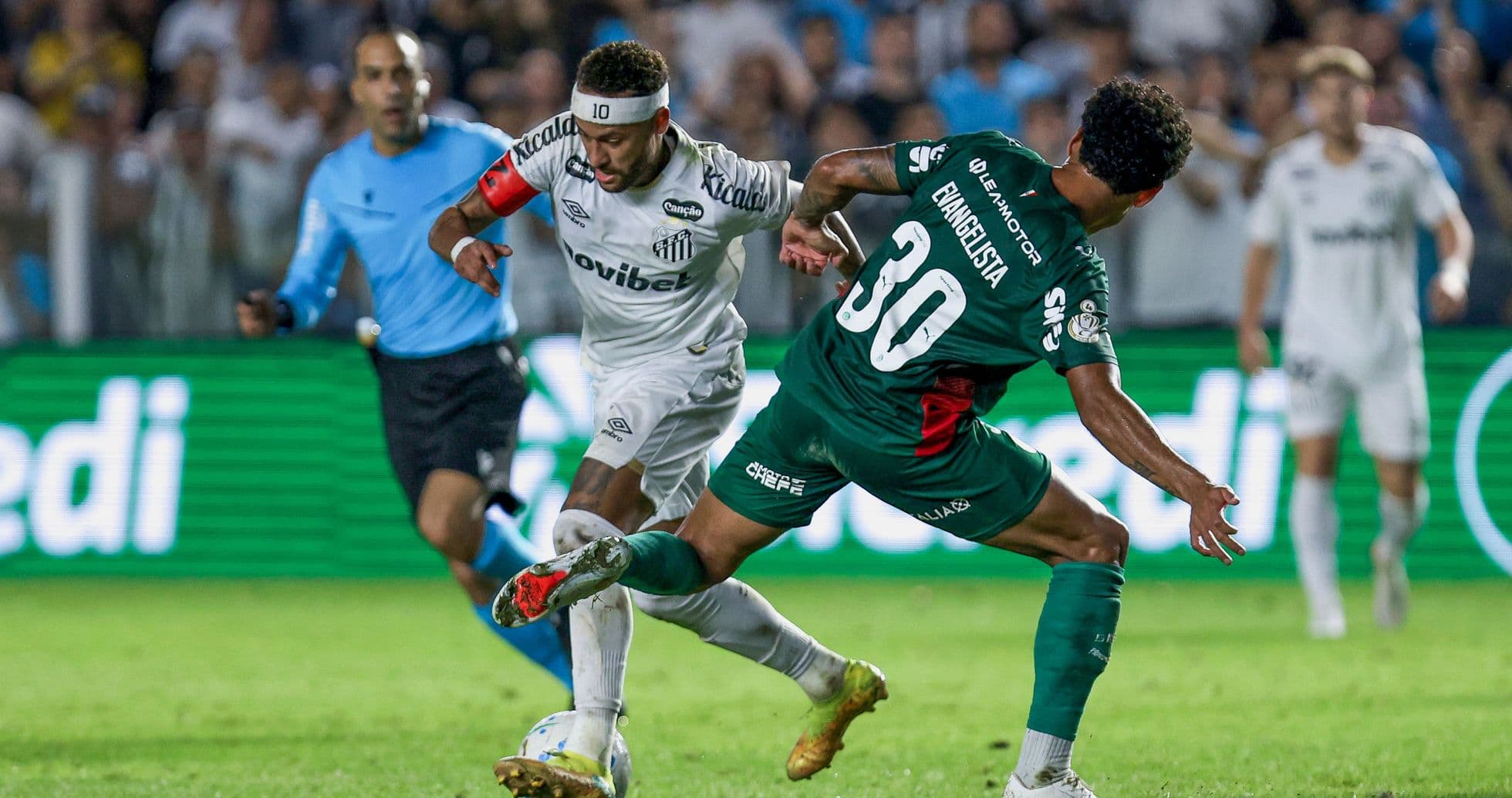 Player dribbling past defender during soccer match Player dribbling past defender during soccer match