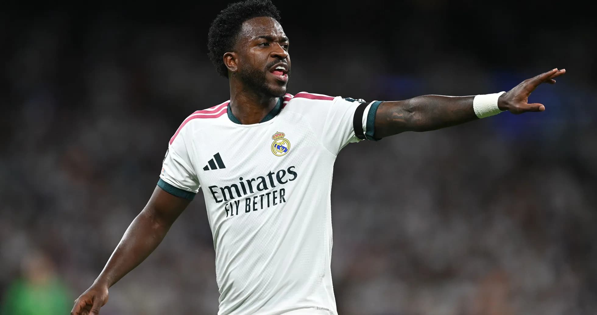 Player gesturing during match in white kit Player gesturing during match in white kit