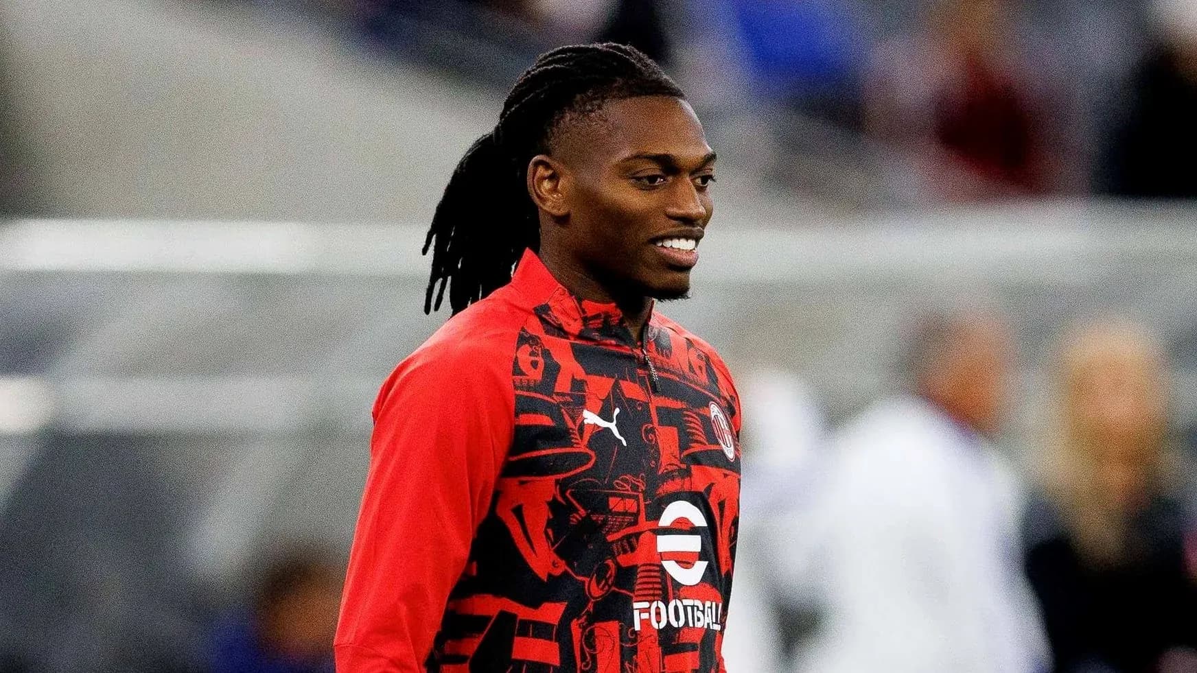 Player smiling while wearing training jacket Player smiling while wearing training jacket