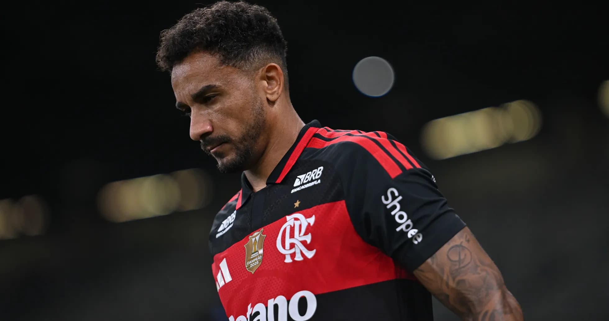 Player wearing Flamengo jersey walking off the field Player wearing Flamengo jersey walking off the field
