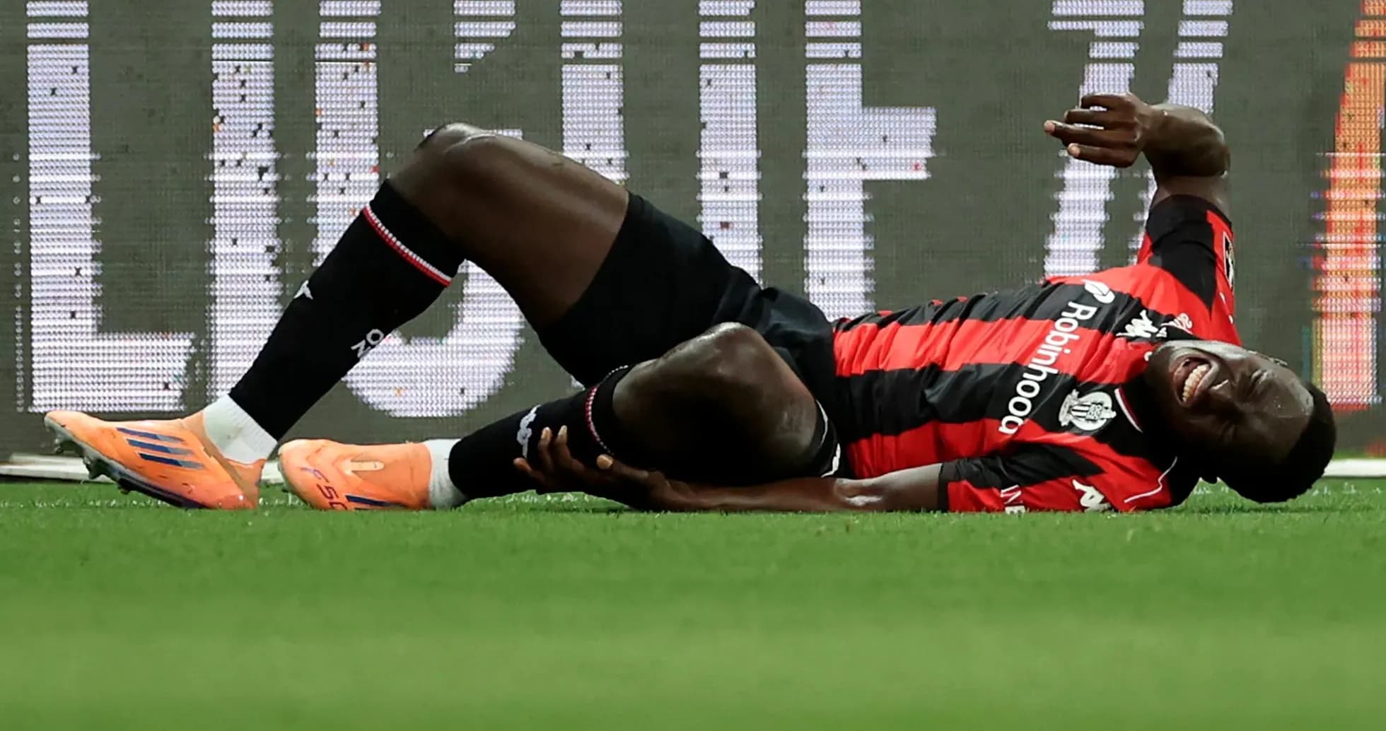 Player lying on ground, injured during match Player lying on ground, injured during match