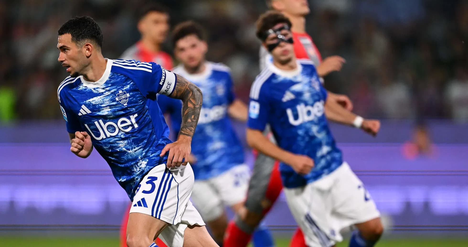Como player celebrating during Serie A match Como player celebrating during Serie A match