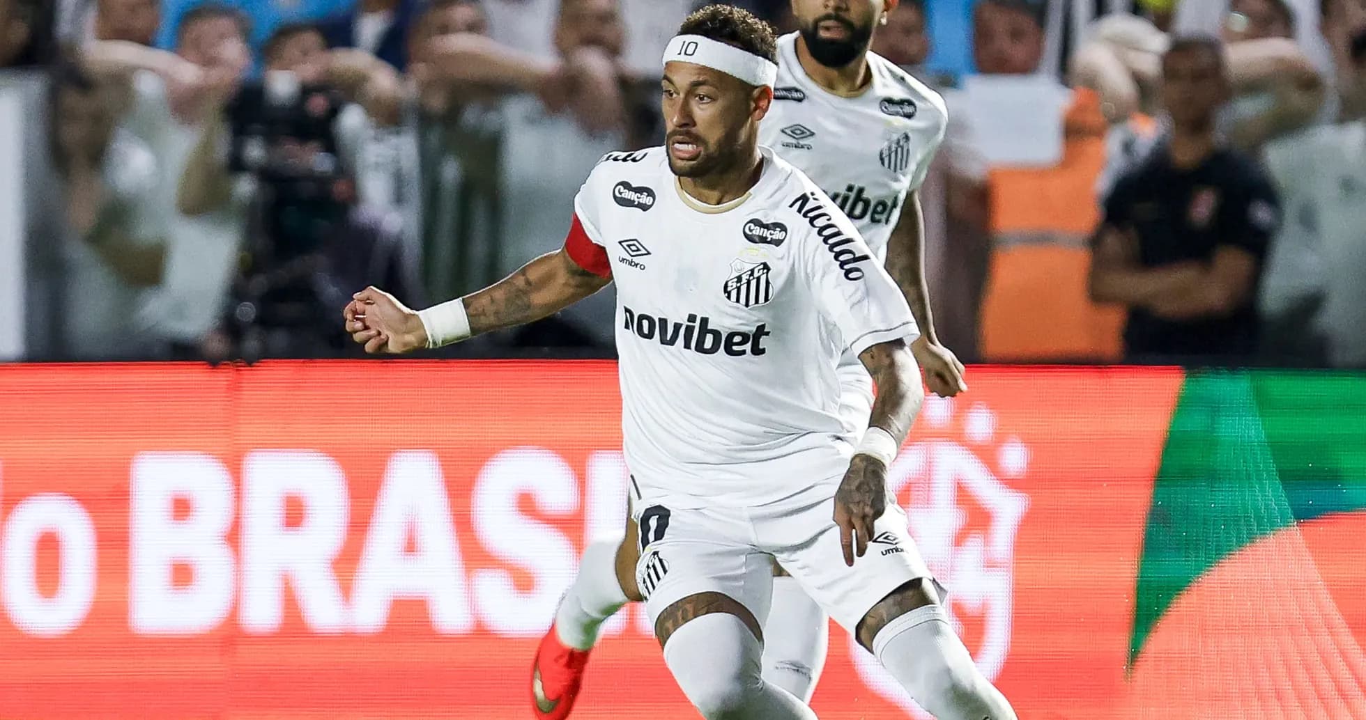 Neymar celebrating during a Santos match Neymar celebrating during a Santos match