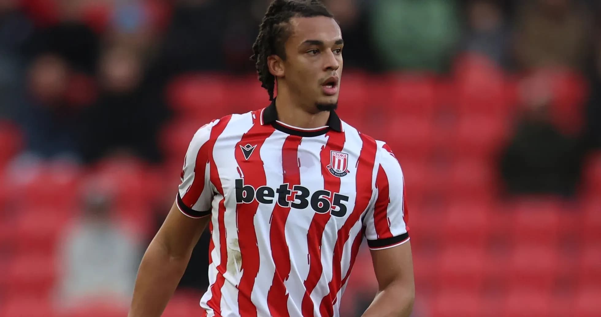 Stoke City player in red and white striped jersey Stoke City player in red and white striped jersey
