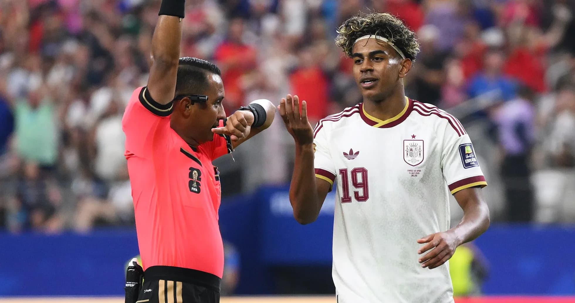 Referee issuing a warning to a player during match Referee issuing a warning to a player during match
