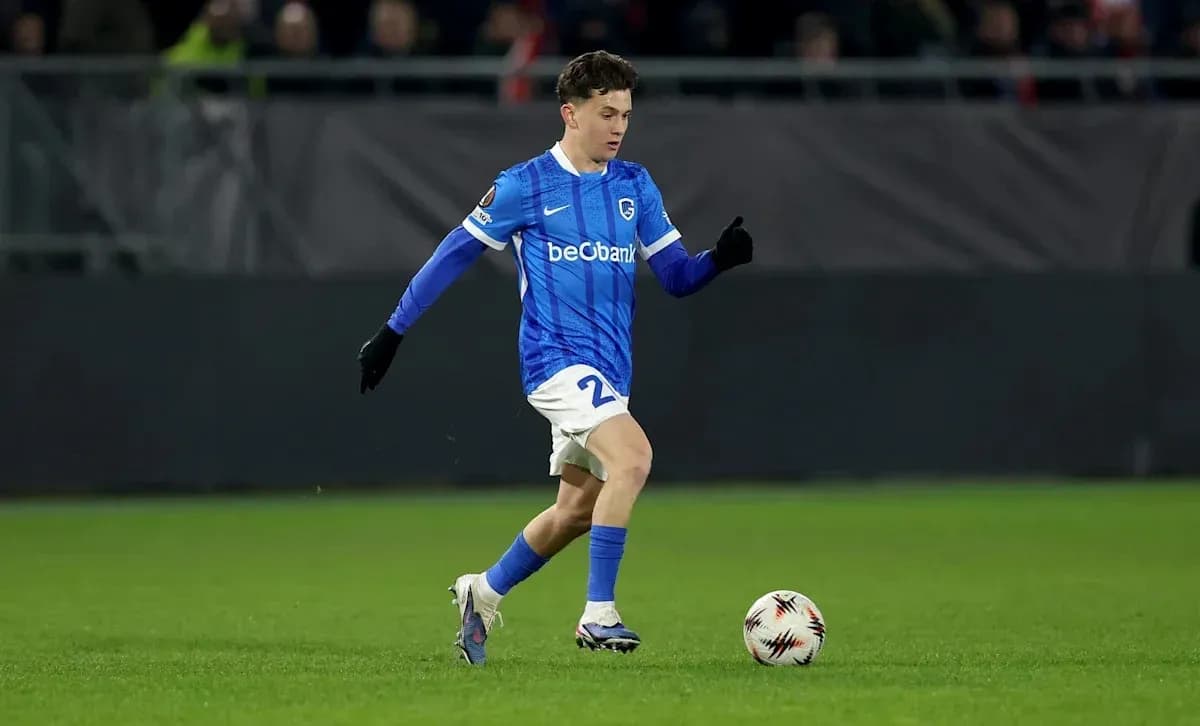 Player in blue kit dribbling a soccer ball Player in blue kit dribbling a soccer ball