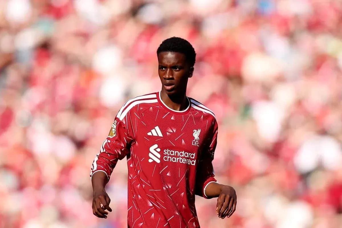 Player in Liverpool kit on the pitch Player in Liverpool kit on the pitch