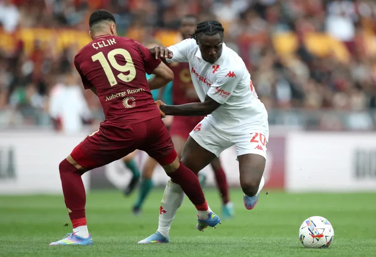 Celik and player contesting for the ball Celik and player contesting for the ball