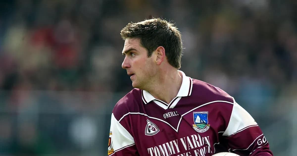 Player in maroon jersey during match action Player in maroon jersey during match action