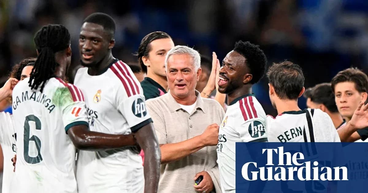 Players celebrating with manager after match victory Players celebrating with manager after match victory