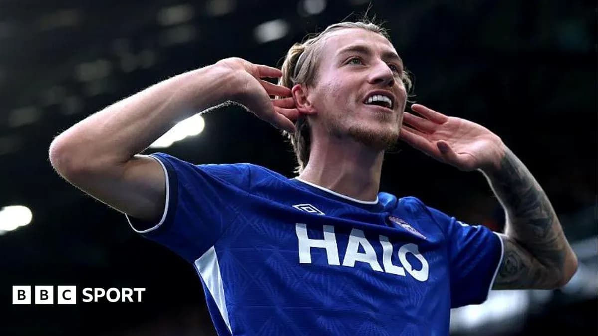 Player celebrating a goal with hand gesture Player celebrating a goal with hand gesture