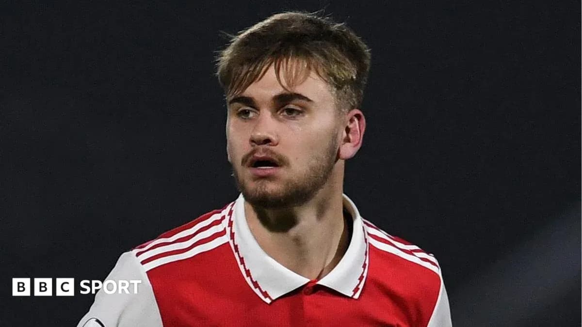 Player in red jersey during football match Player in red jersey during football match