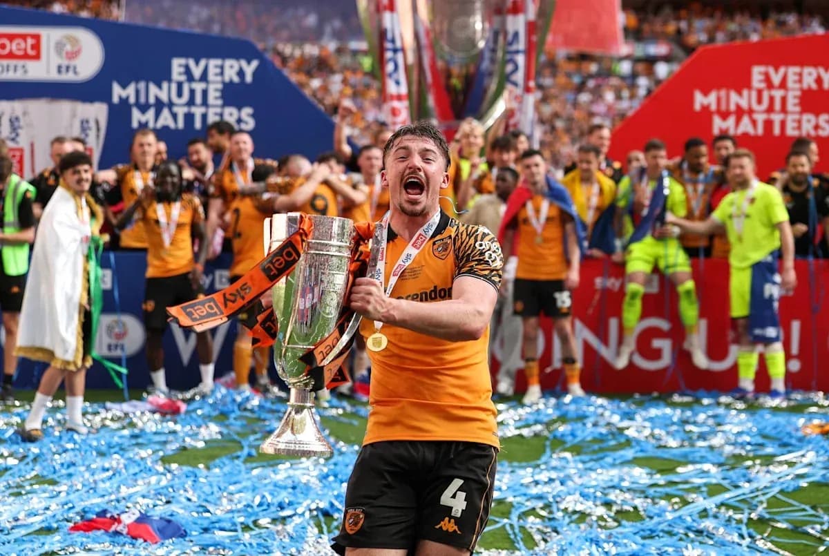 Player celebrating with trophy during victory ceremony Player celebrating with trophy during victory ceremony
