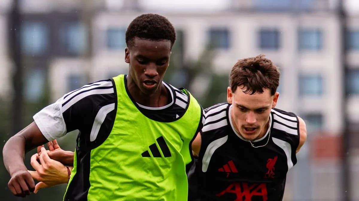 Two players competing for the ball in training Two players competing for the ball in training