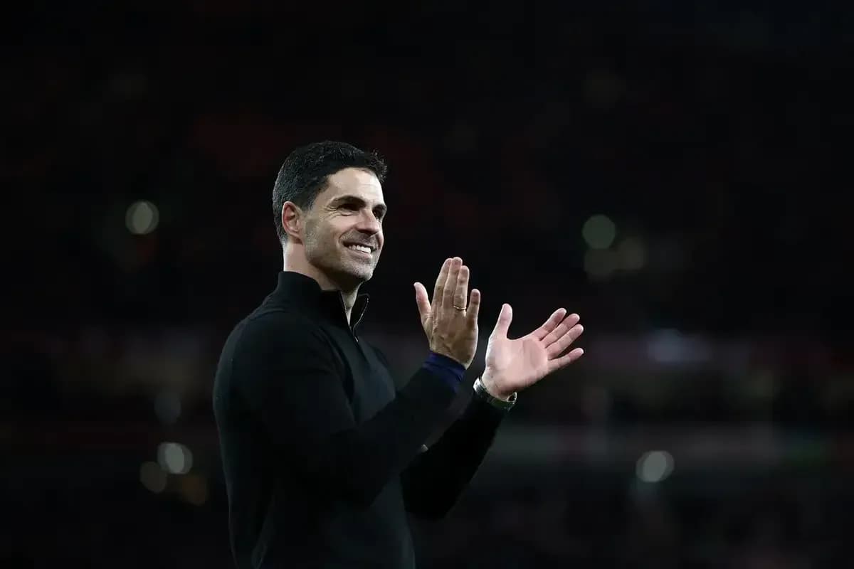 Manager applauding during post-match celebration Manager applauding during post-match celebration
