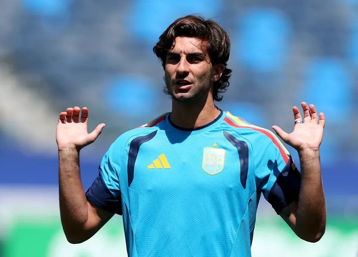 Player in training shirt gesturing during practice session Player in training shirt gesturing during practice session