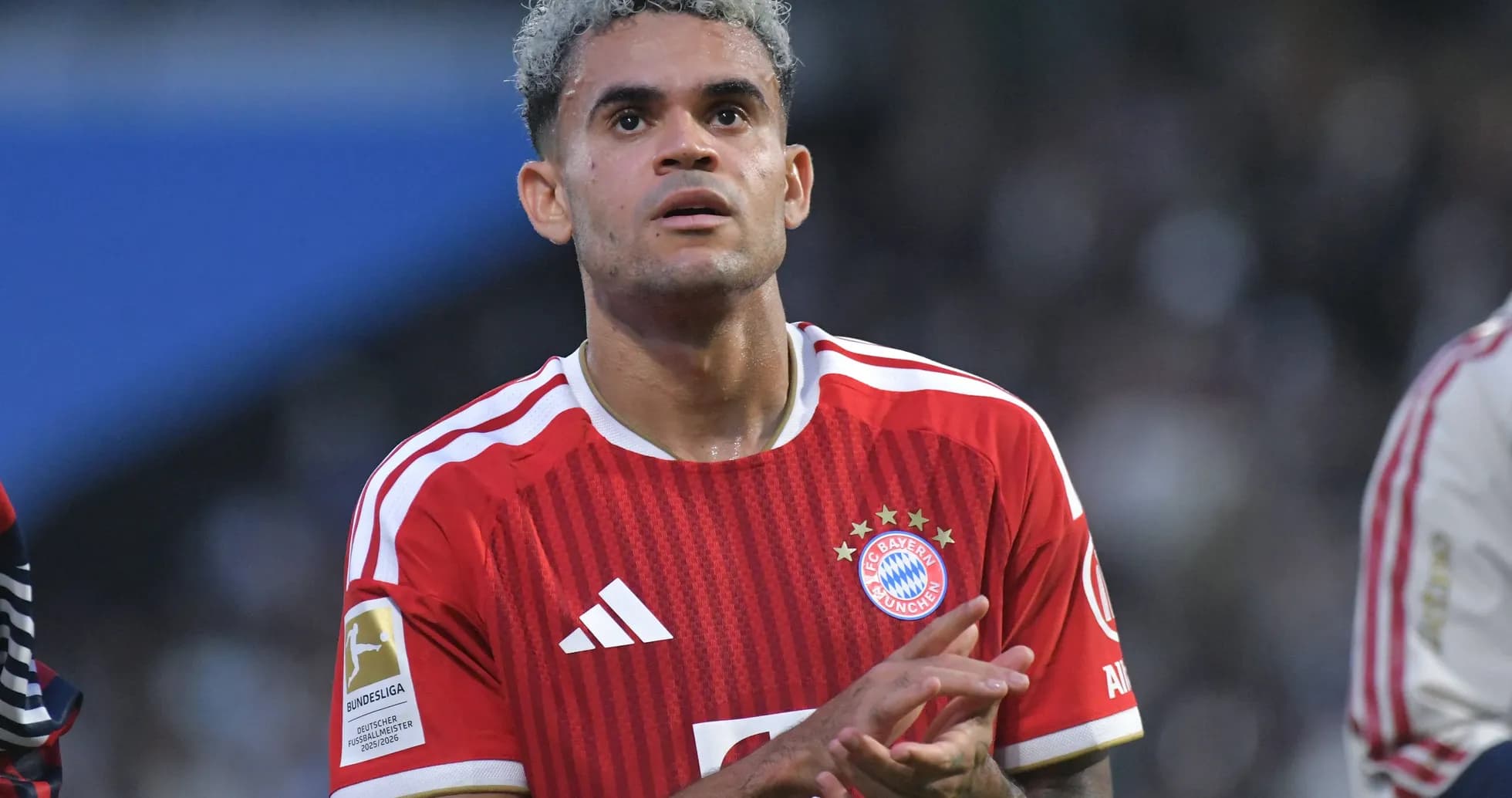 Player in Bayern Munich jersey applauding fans Player in Bayern Munich jersey applauding fans