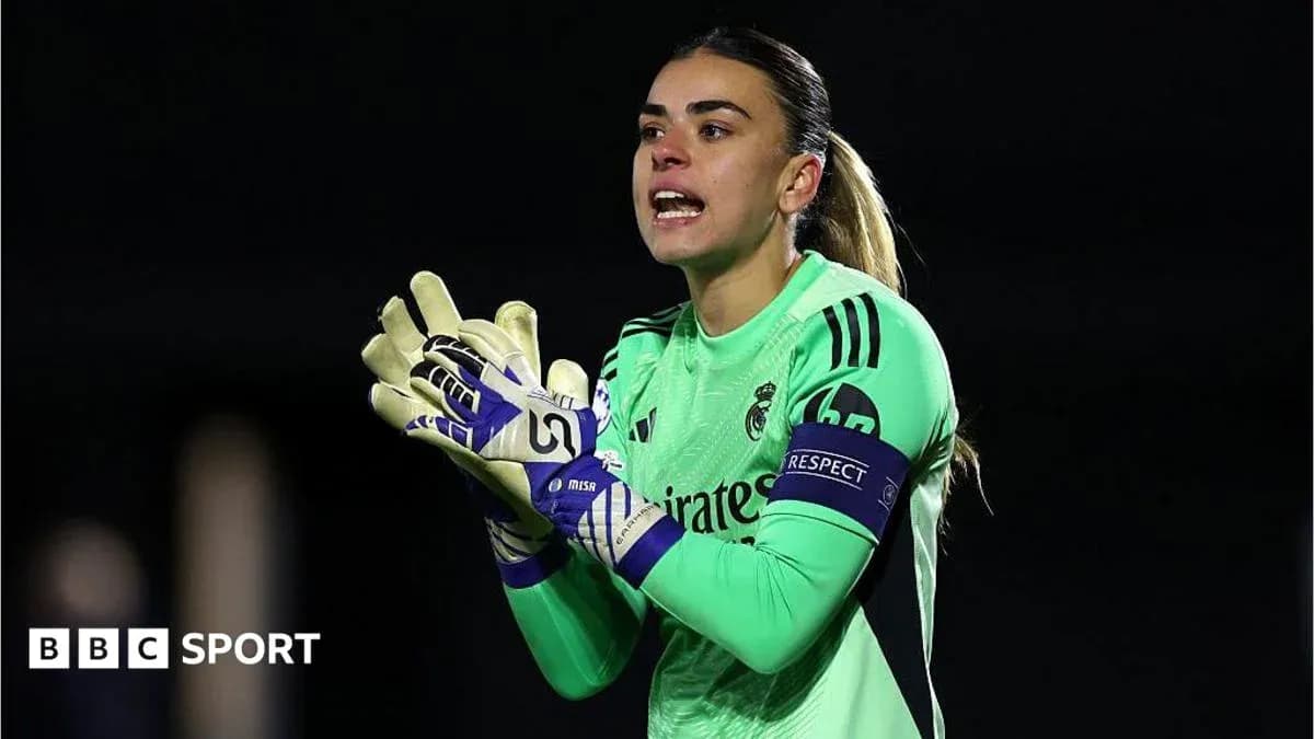 Goalkeeper in green kit directing teammates during match Goalkeeper in green kit directing teammates during match
