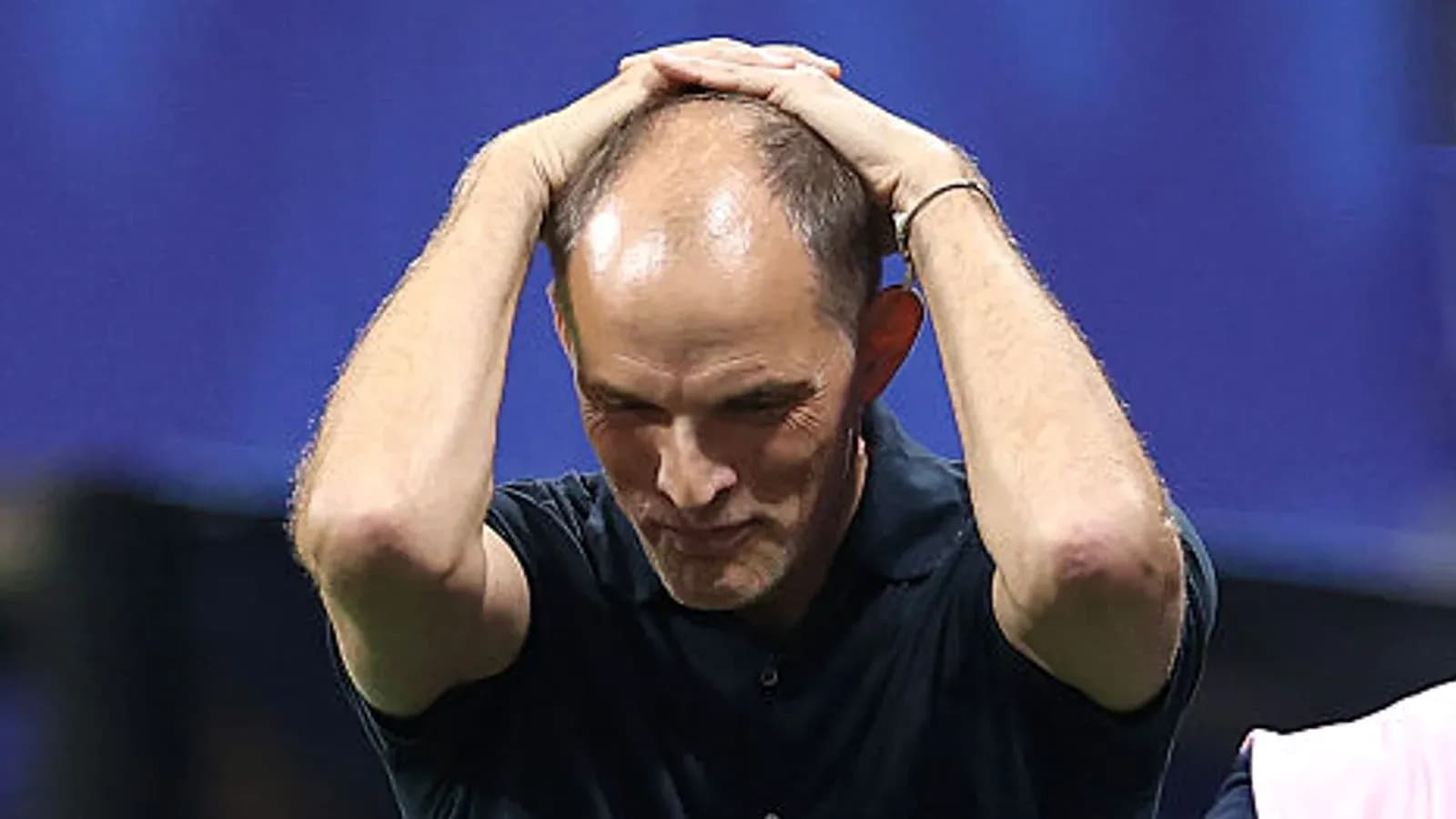 Coach holding head in frustration during match Coach holding head in frustration during match
