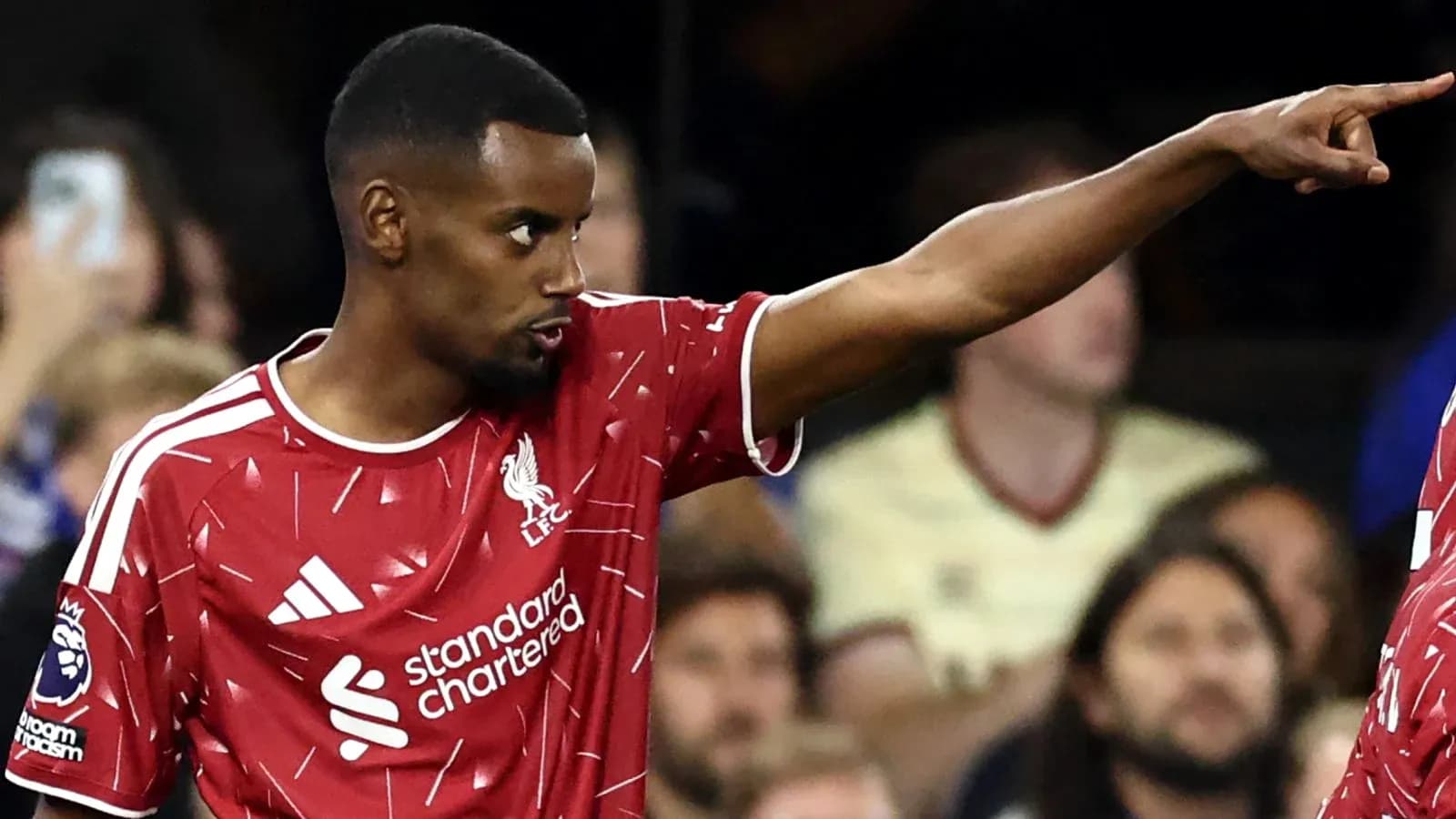Player pointing during a match wearing Liverpool kit Player pointing during a match wearing Liverpool kit
