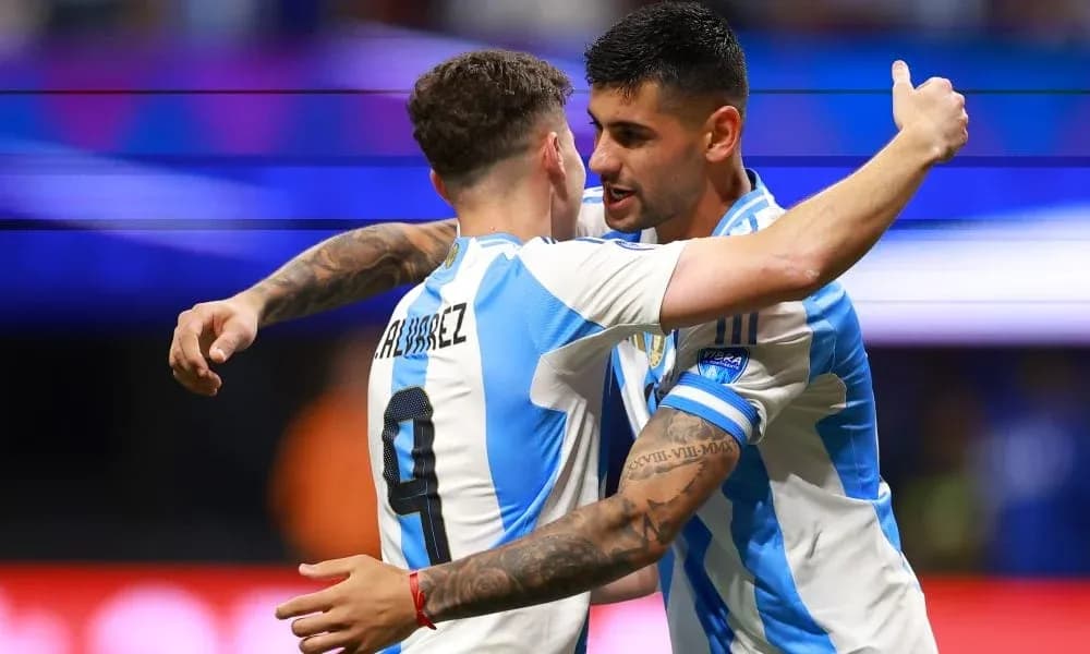 Two Argentina players celebrating a goal together Two Argentina players celebrating a goal together