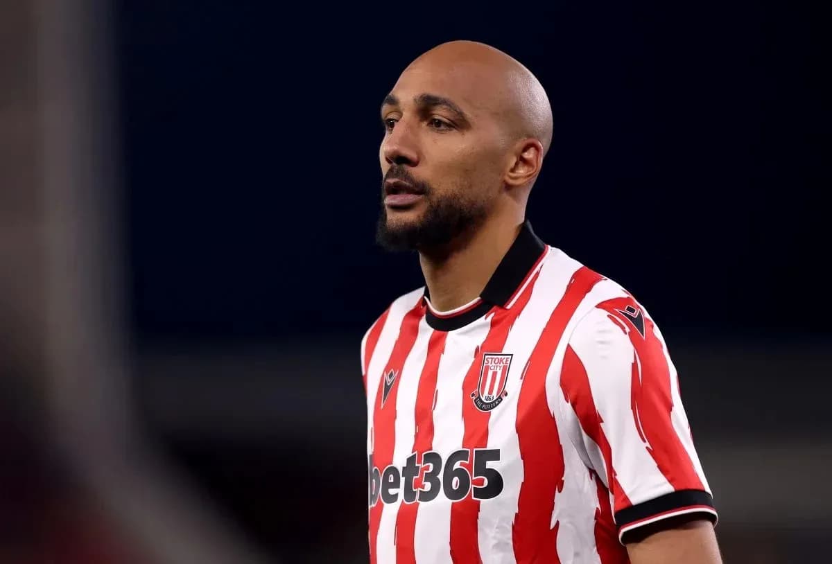 Player wearing Stoke City jersey on the field Player wearing Stoke City jersey on the field