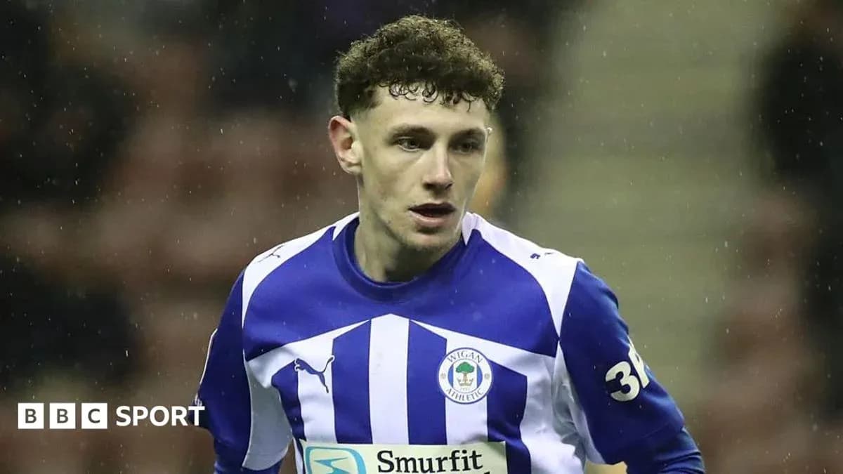Wigan Athletic player in blue and white kit Wigan Athletic player in blue and white kit