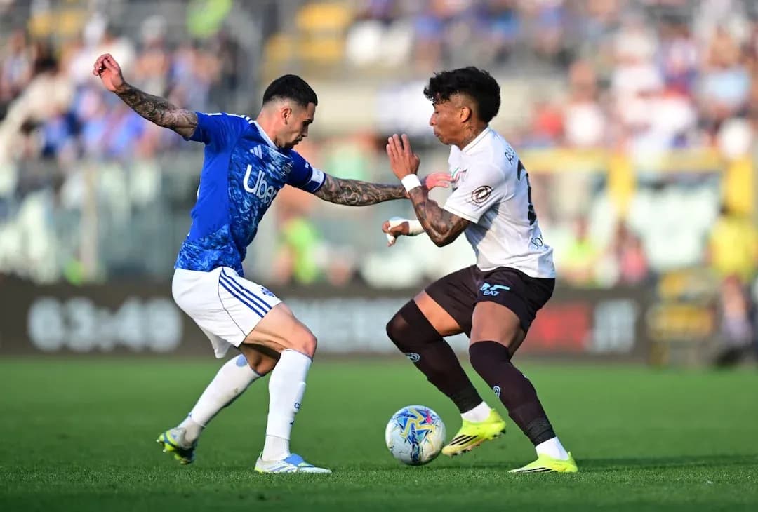 Two players competing for the ball in match Two players competing for the ball in match