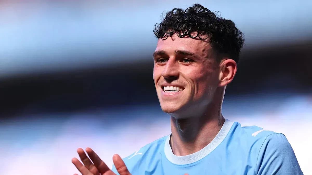 Player smiling and applauding in light blue jersey Player smiling and applauding in light blue jersey
