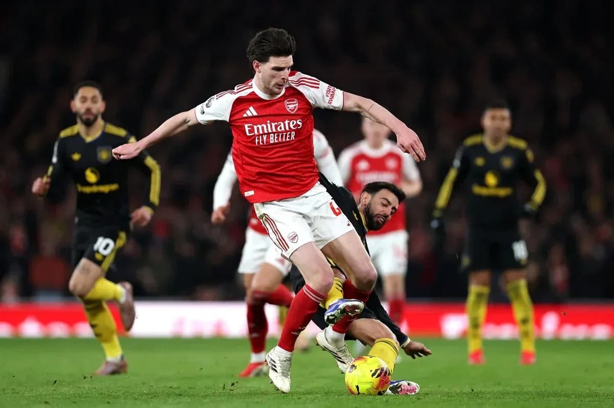 Arsenal player tackled during match at Emirates Stadium Arsenal player tackled during match at Emirates Stadium