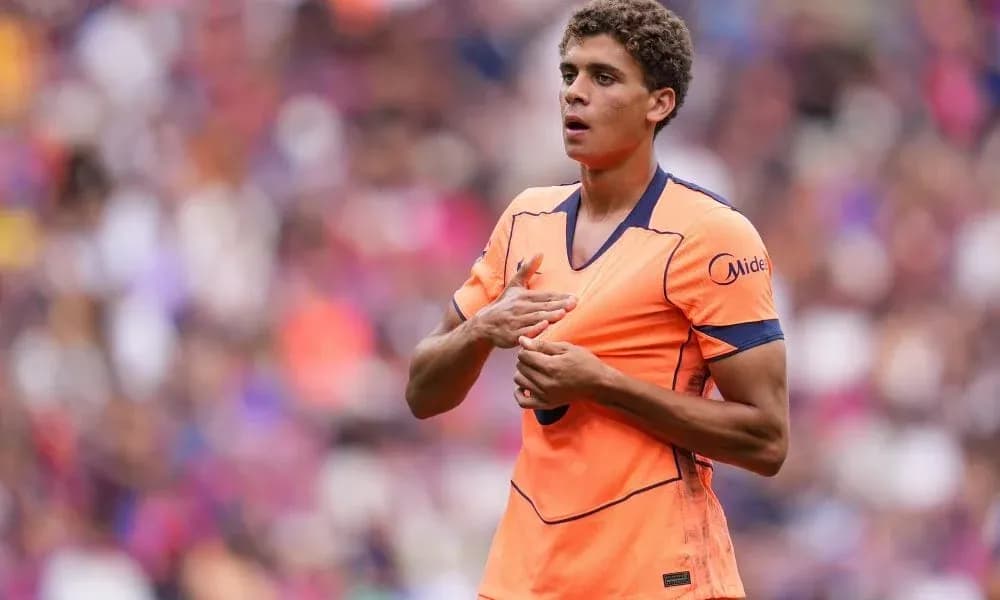 Player gesturing during match in orange jersey Player gesturing during match in orange jersey