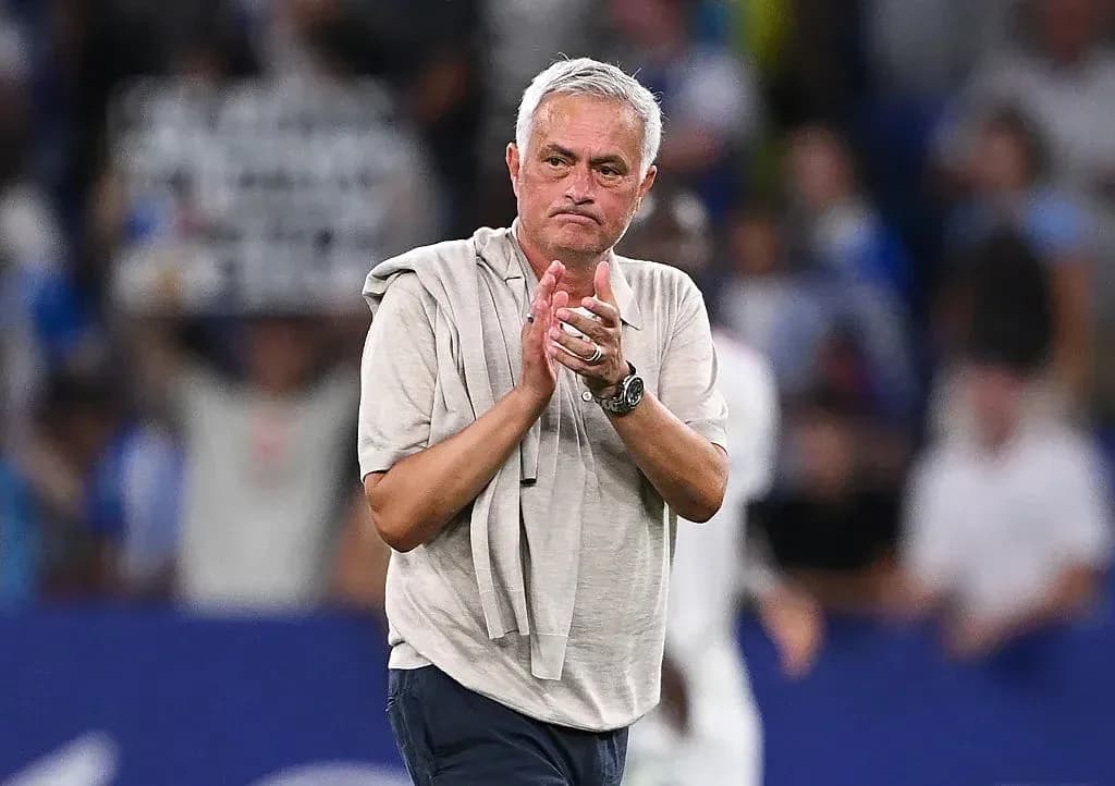 Manager applauding fans after match conclusion Manager applauding fans after match conclusion