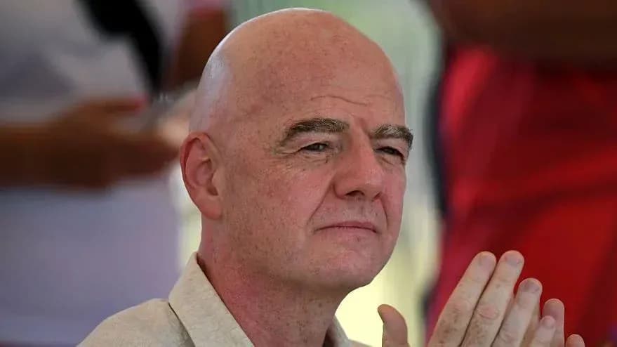 Man with bald head sitting and observing event Man with bald head sitting and observing event