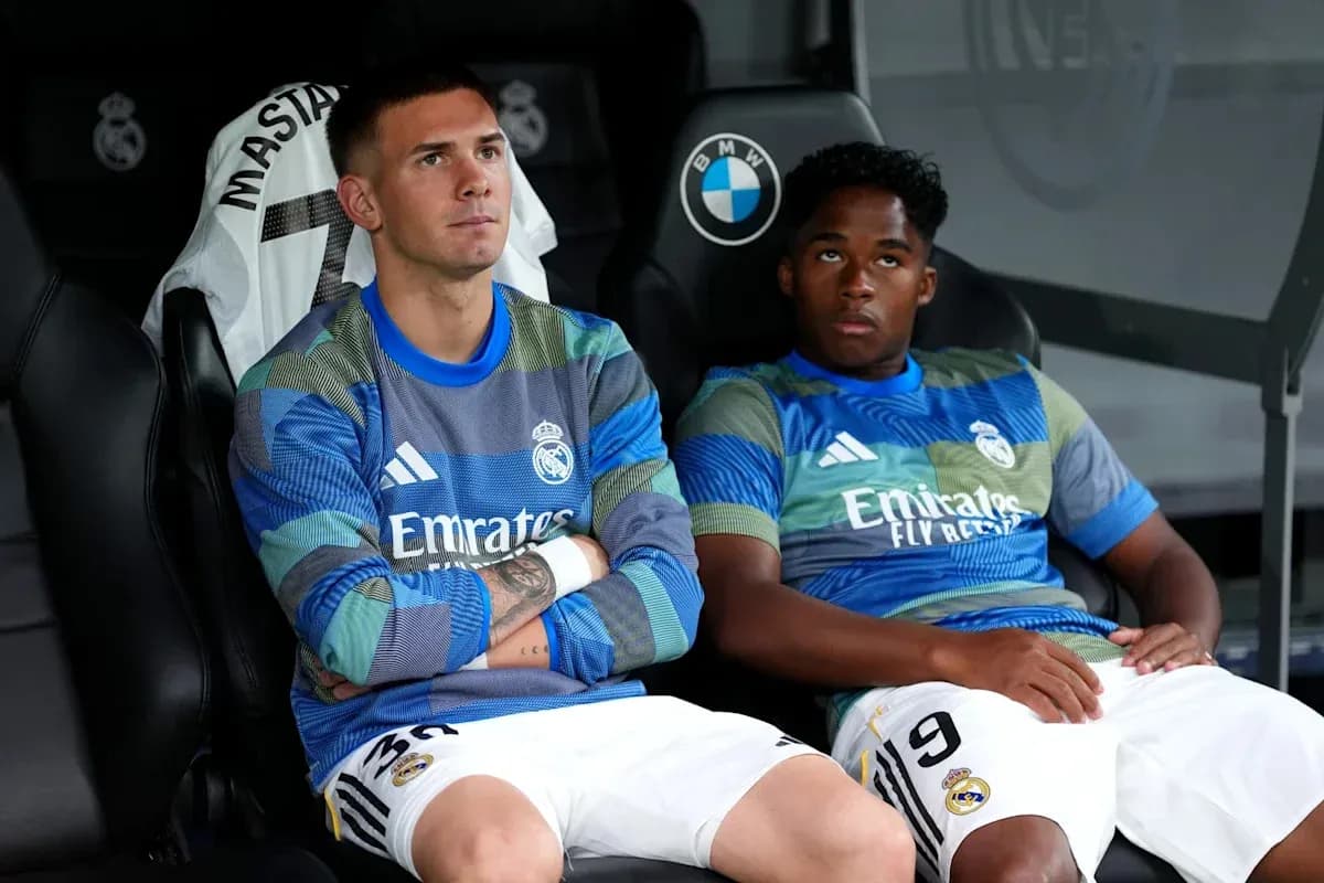 Two Real Madrid players sitting on bench Two Real Madrid players sitting on bench