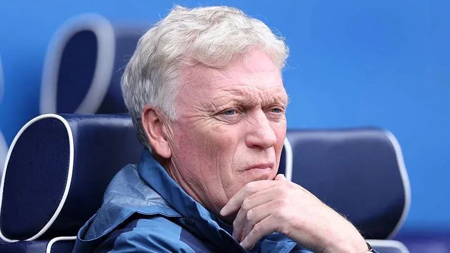 Coach sitting on bench during match Coach sitting on bench during match