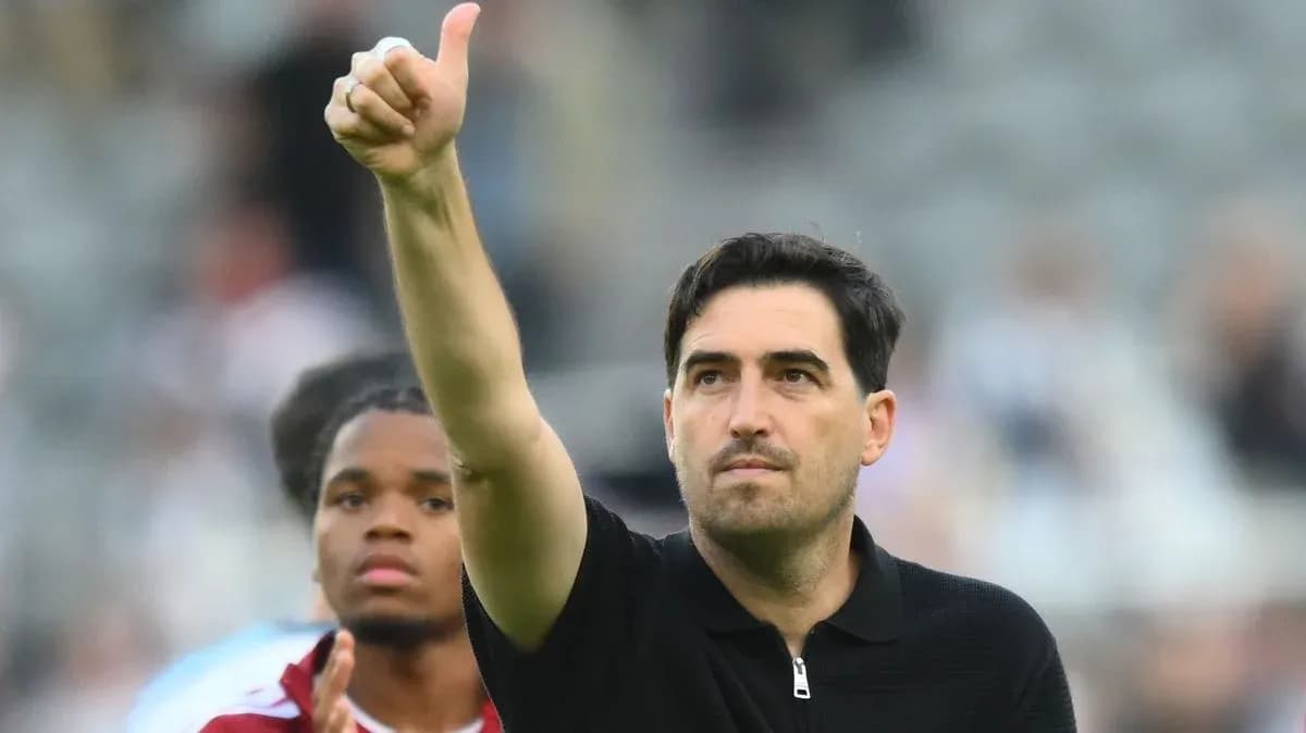 Coach giving thumbs up after match Coach giving thumbs up after match